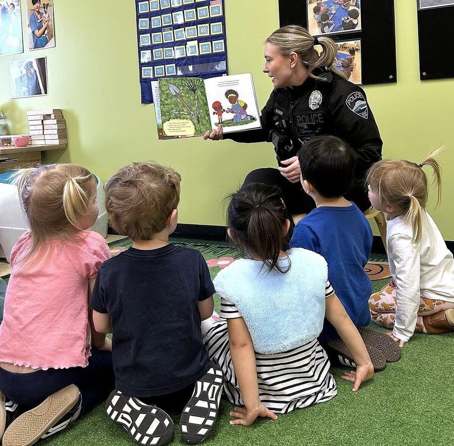 Officer reading to children